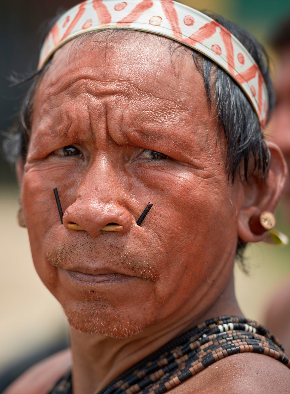 His face painted red with urucum, a man participates in a march by indigenous people through the streets of Atalaia do Norte in Brazil's Amazon region March 27, 2019. The Vatican released Pope Francis' postsynodal apostolic exhortation, "Querida Amazonia" (Beloved Amazonia), Feb. 12, 2020.